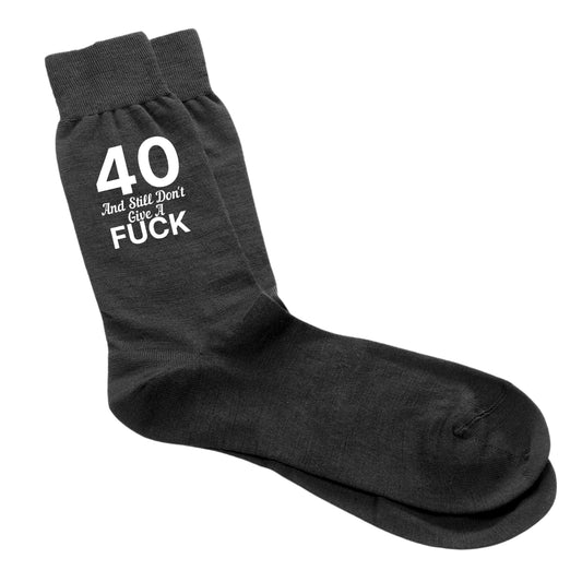 Funny 40th birthday socks for men with the phrase "40 And Still Don’t Give A Fuck".
Cosy and cheeky socks, size 6-12, perfect for milestone birthdays.
